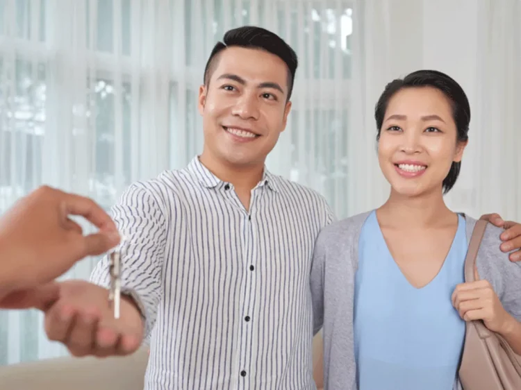 Couple getting keys Get rental home keys